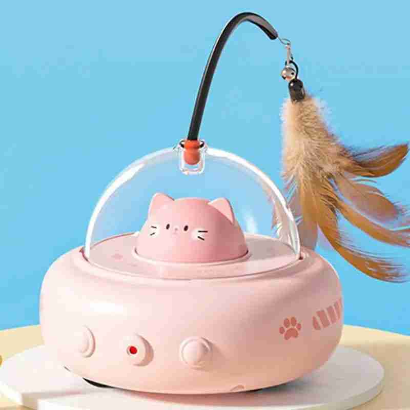 Cat watching electric cat interactive toy with feather and red light