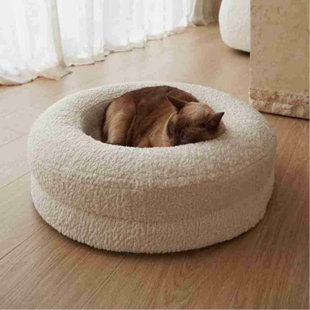 Pet round bed with a cat resting inside
