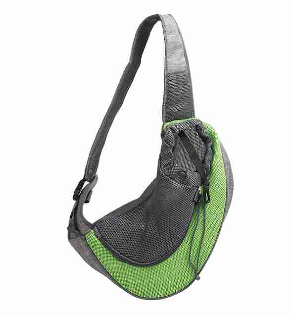 Green pet carrier shoulder bag with small pet inside