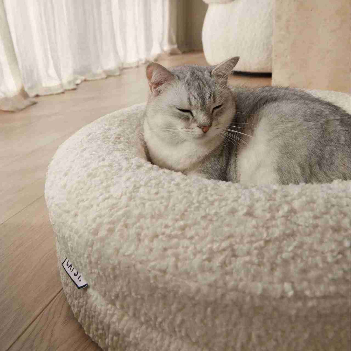 Pet round bed with a cat sleeping