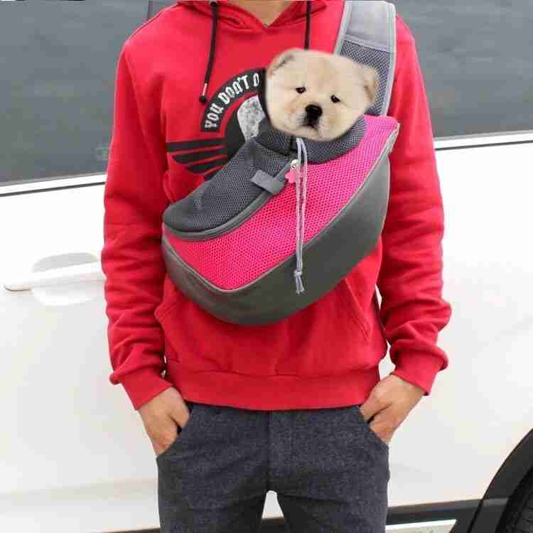 Pet carrier shoulder bag with puppy inside