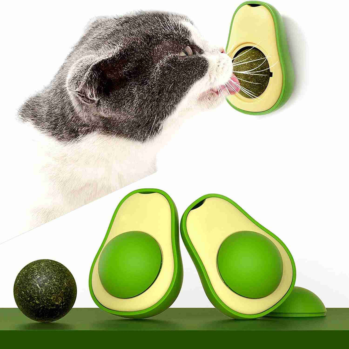 Cat playing with avocado catnip toy on wall