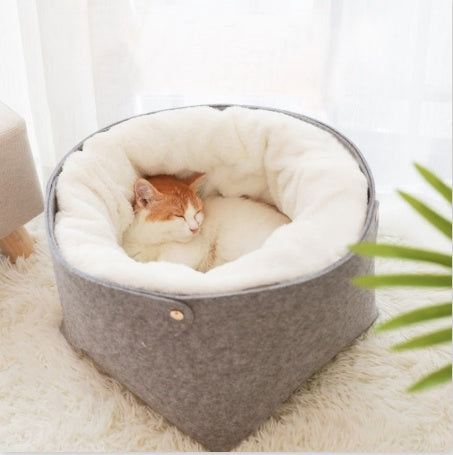 Cat resting in soft pet bed with plush lining