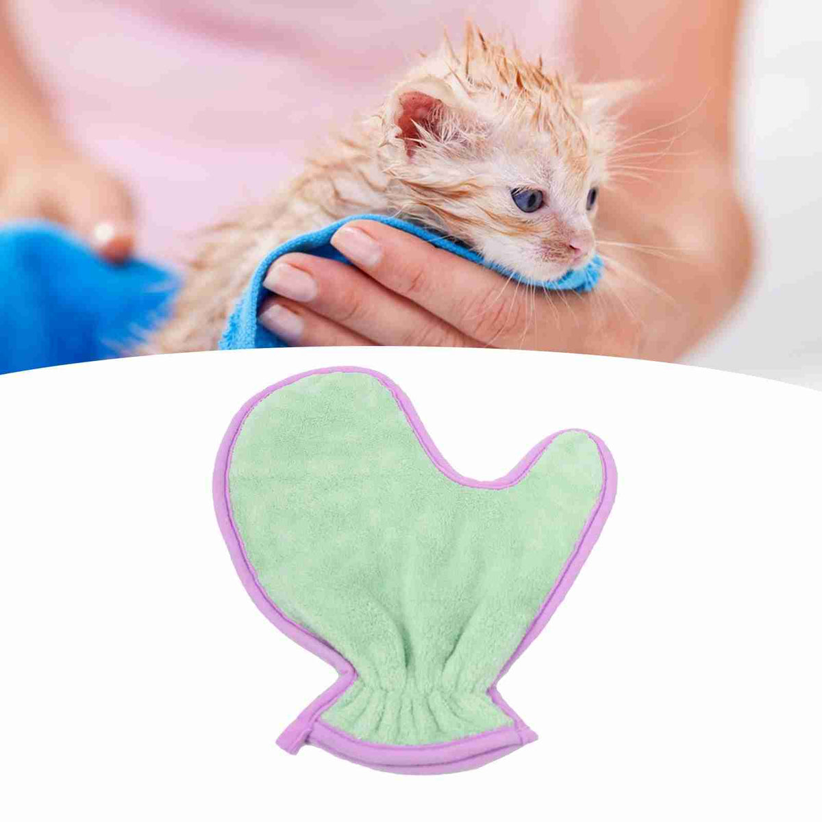 Wet orange tabby cat being dried with microfiber glove