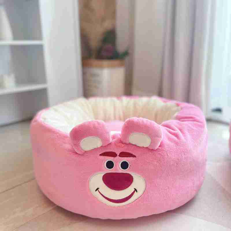 Pink plush pet bed with bear face design for small pets