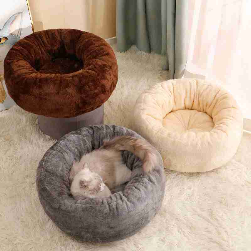 Brown plush pet bed with cat relaxing inside