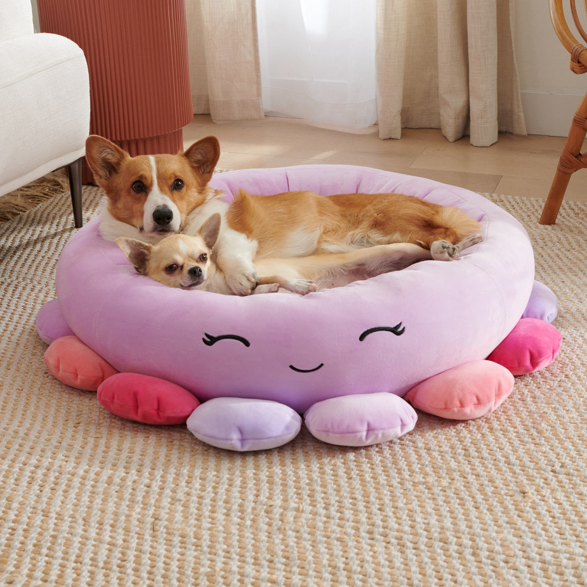Pink plush pet bed with animal and fruit design
