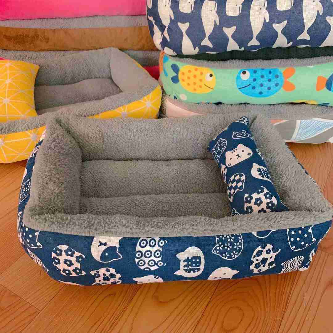 Gray fleece pet bed with plush interior for small pets