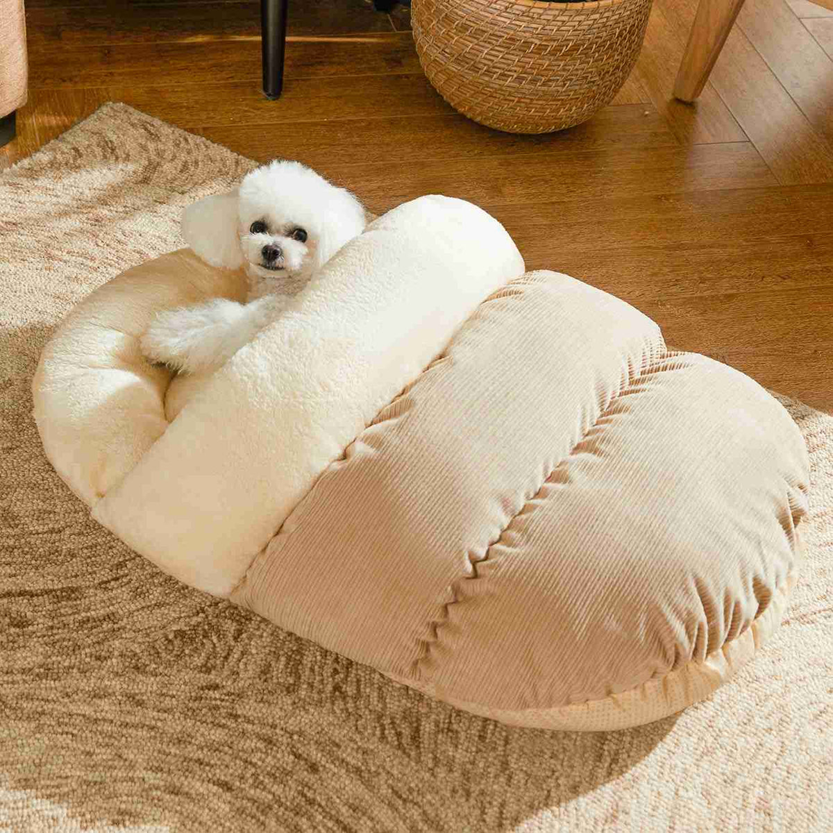 Cream plush pet bed with a small white dog resting on it
