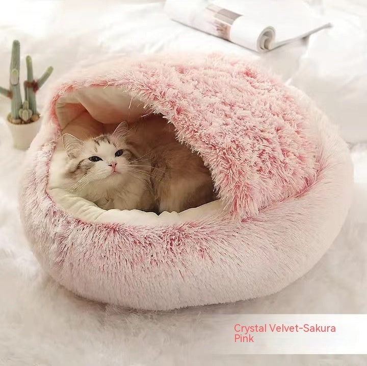 Pink plush pet bed with cat